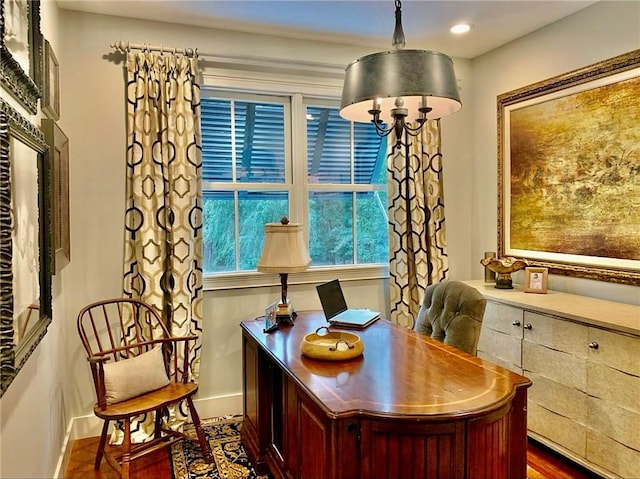 home office with dark hardwood / wood-style floors