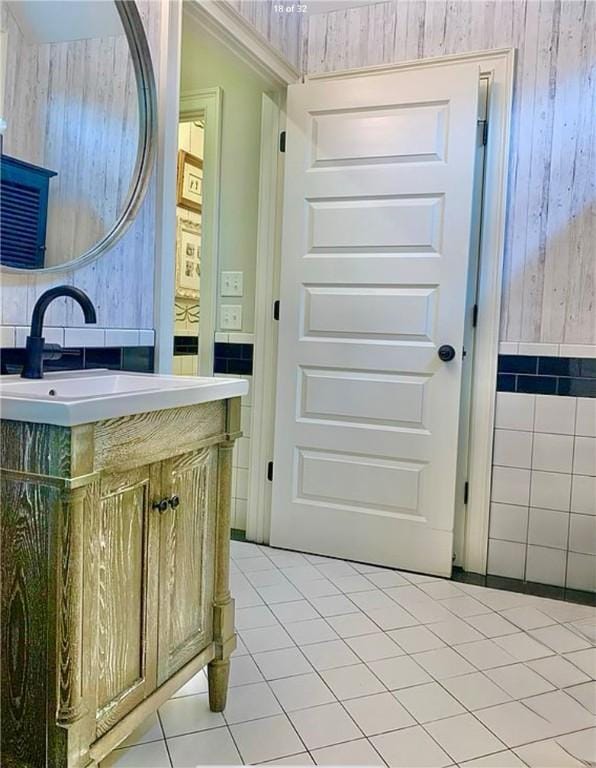 bathroom featuring tile patterned flooring and vanity