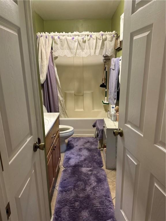 full bathroom featuring tile patterned floors, vanity, toilet, and shower / tub combo with curtain