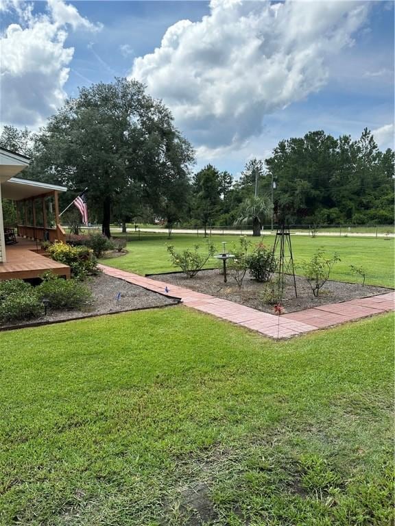 view of home's community featuring a lawn