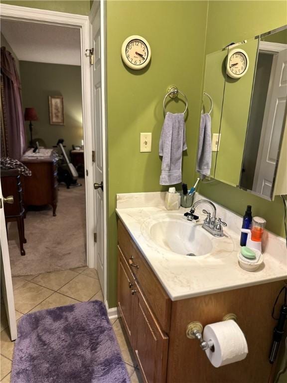 bathroom featuring tile patterned flooring and vanity