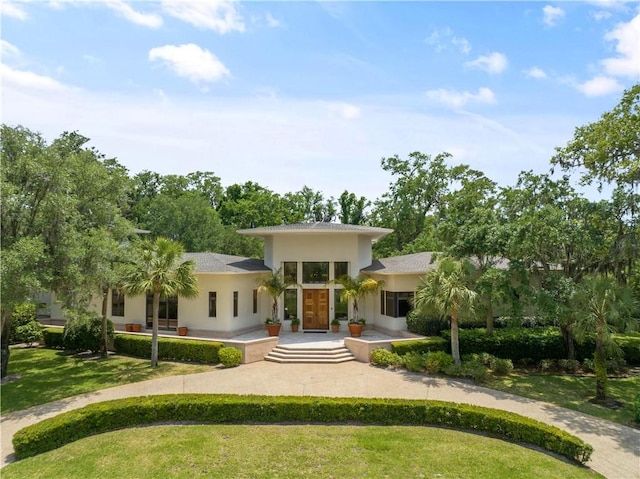 view of front of home with a front lawn