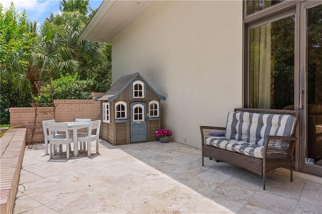 view of patio featuring an outdoor structure