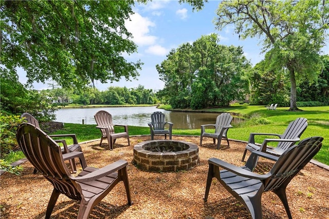 view of patio / terrace with a water view and a fire pit