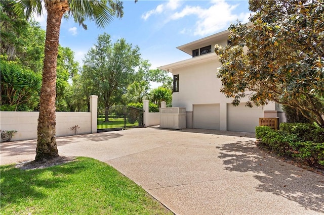 view of side of property featuring a garage