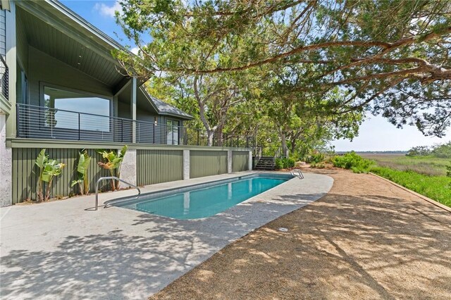 outdoor pool featuring a patio