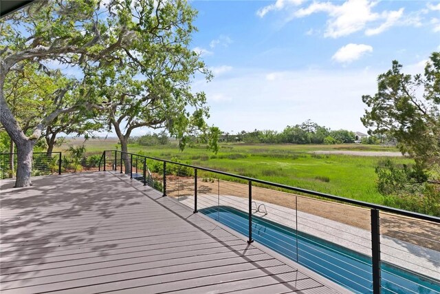 wooden deck featuring a rural view