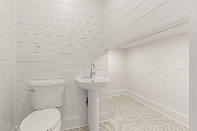 half bathroom featuring toilet