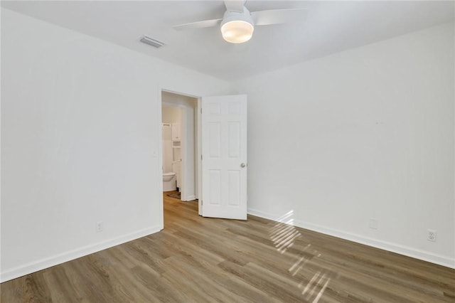 unfurnished room with wood-type flooring and ceiling fan