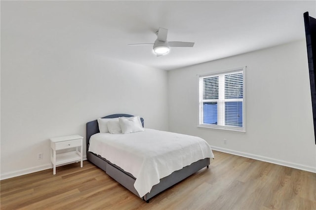 bedroom featuring ceiling fan and light hardwood / wood-style flooring