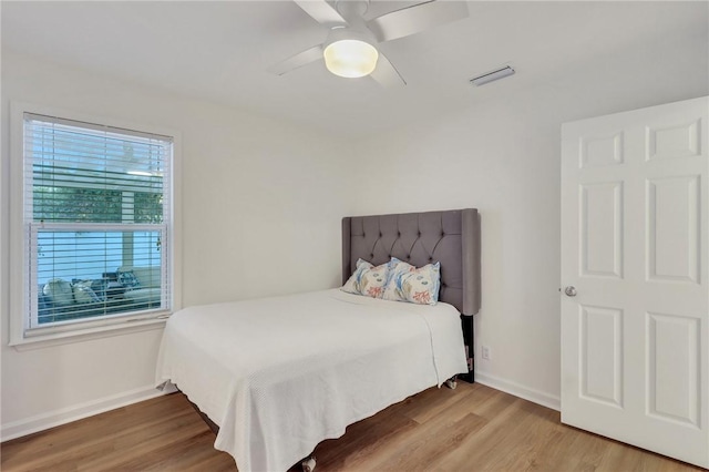 bedroom featuring hardwood / wood-style floors and ceiling fan