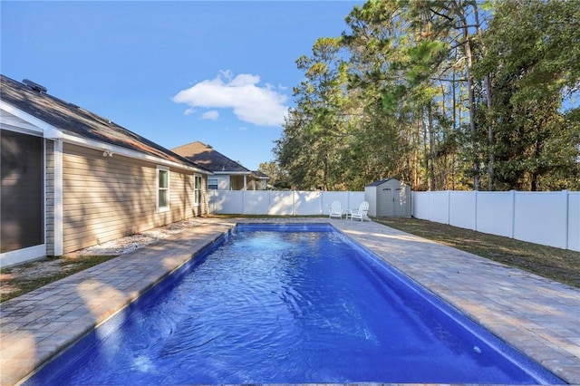 view of swimming pool featuring a storage unit