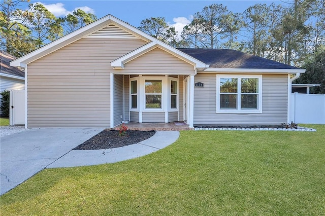 ranch-style home with a front yard