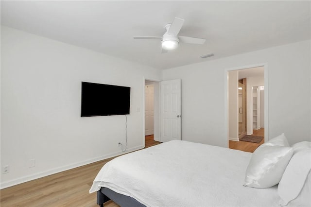 bedroom with ceiling fan and hardwood / wood-style flooring