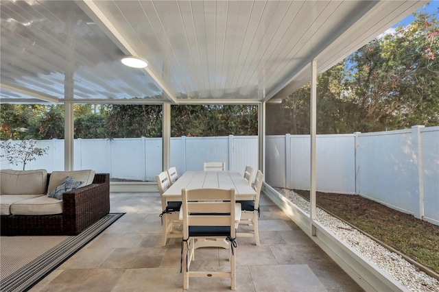 sunroom featuring wooden ceiling