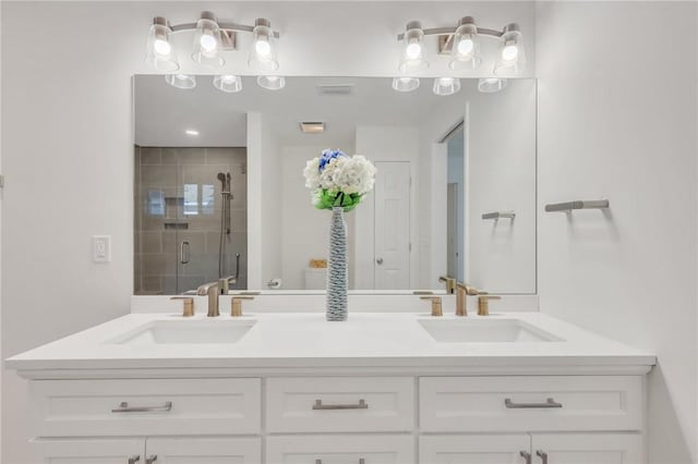 bathroom with vanity and an enclosed shower