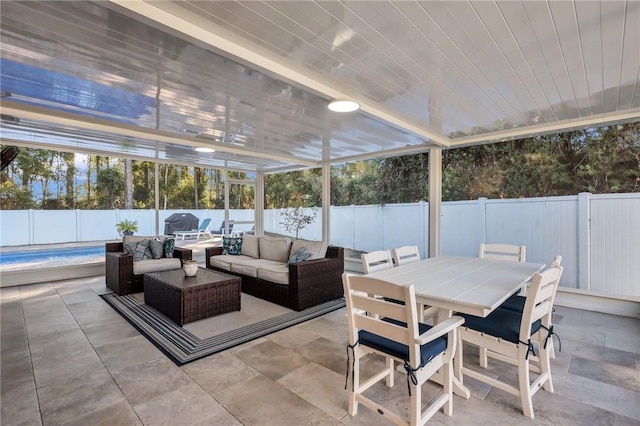 sunroom featuring wooden ceiling