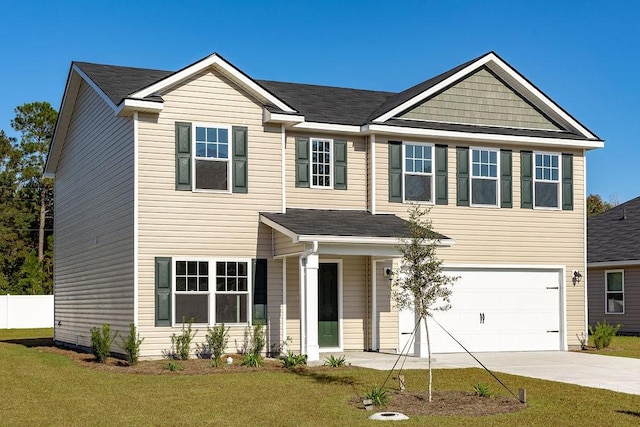 view of front of home with a garage and a front yard