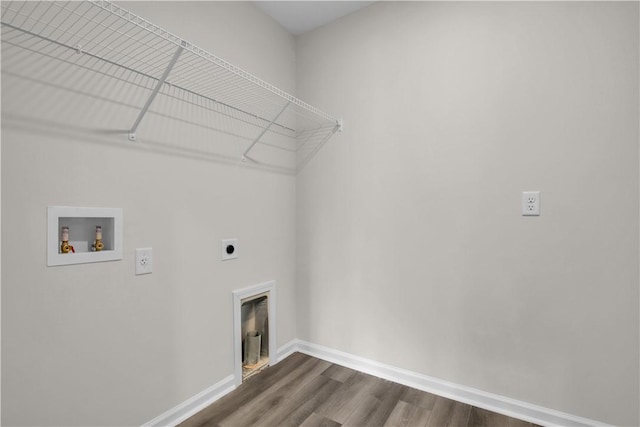 clothes washing area featuring hookup for a washing machine, wood-type flooring, and hookup for an electric dryer