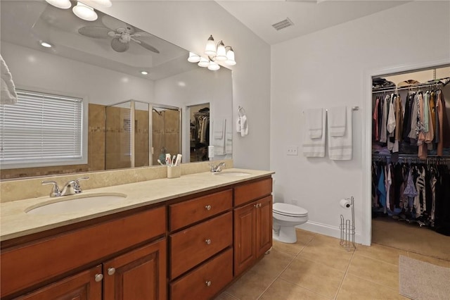 full bath featuring a sink, tile patterned flooring, a ceiling fan, and double vanity