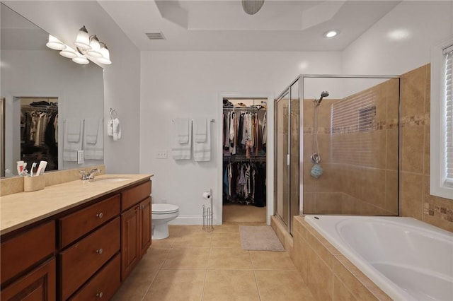 full bath with visible vents, a shower stall, tile patterned floors, vanity, and tiled bath