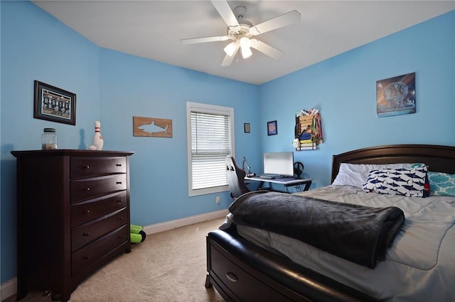 carpeted bedroom with baseboards and a ceiling fan