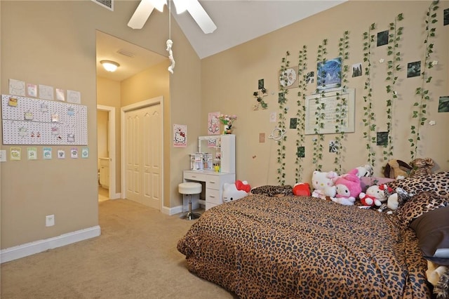 bedroom with carpet flooring, ceiling fan, baseboards, lofted ceiling, and a closet