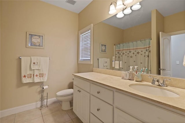 bathroom featuring visible vents, tile patterned floors, baseboards, vanity, and toilet