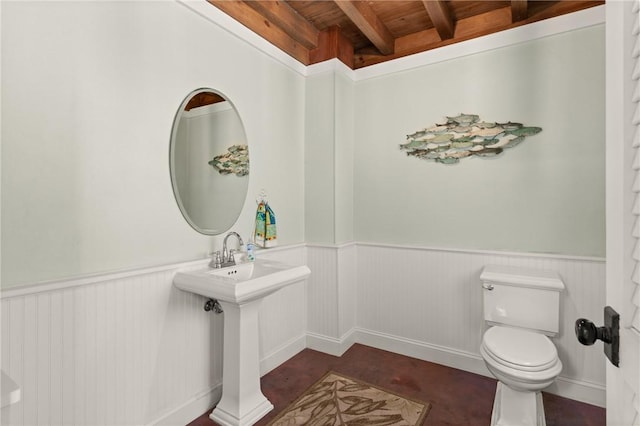 622 Beachview Dr, Saint Simons Island, GA 31522 - half bath featuring a wood ceiling with exposed beams and a wainscoted wall
