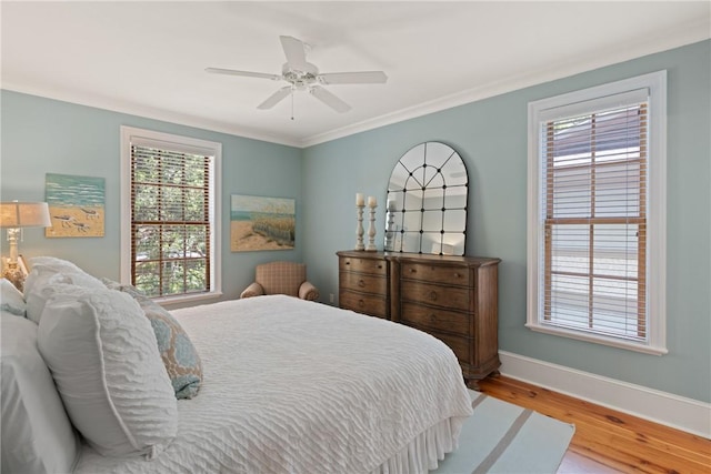 622 Beachview Dr, Saint Simons Island, GA 31522 - bedroom with wood finished floors, a ceiling fan, and crown molding