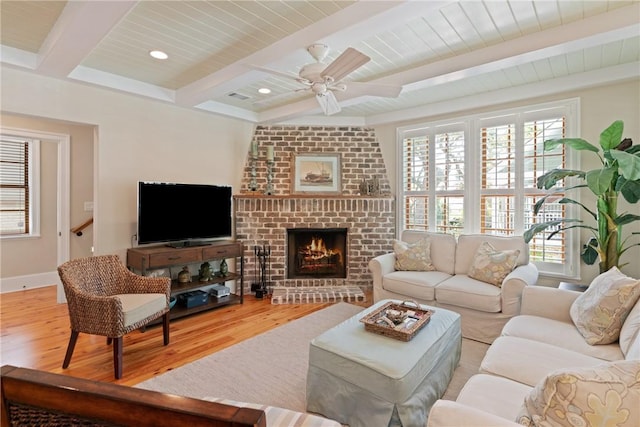 622 Beachview Dr, Saint Simons Island, GA 31522 - living room with wood finished floors, beamed ceiling, healthy amount of natural light, a fireplace, and recessed lighting
