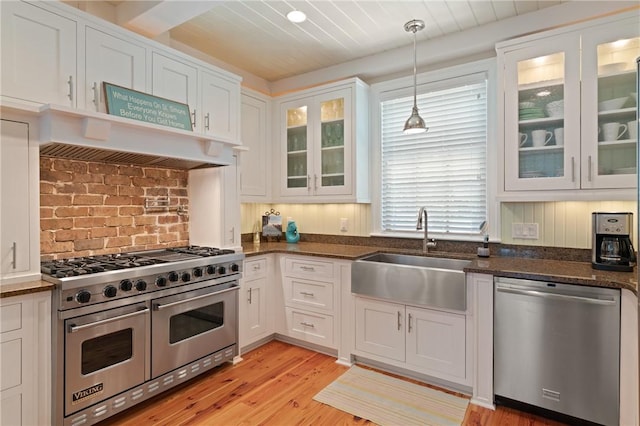 622 Beachview Dr, Saint Simons Island, GA 31522 - kitchen with stainless steel appliances, white cabinetry, and light wood-type flooring