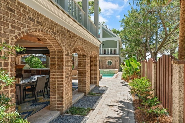 622 Beachview Dr, Saint Simons Island, GA 31522 - patio / terrace with a patio, outdoor dining area, grilling area, and a hot tub