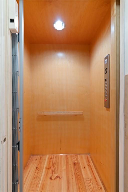 622 Beachview Dr, Saint Simons Island, GA 31522 - elevator with wood finished floors and recessed lighting