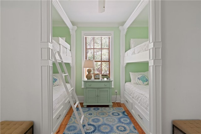 622 Beachview Dr, Saint Simons Island, GA 31522 - bedroom with light wood-style floors, ceiling fan, and ornamental molding