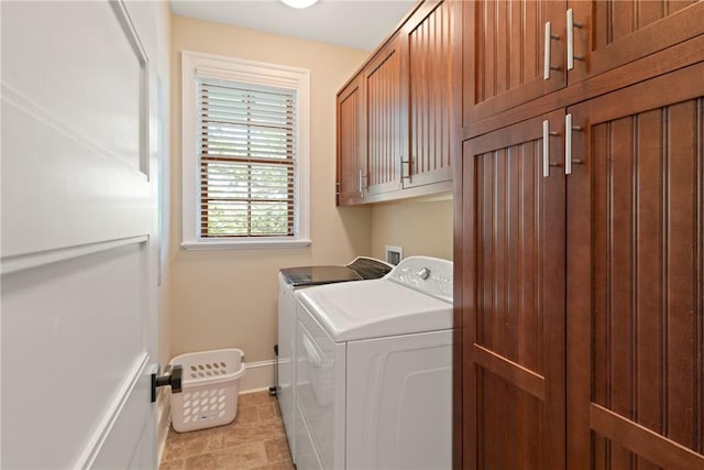 622 Beachview Dr, Saint Simons Island, GA 31522 - washroom featuring washer and dryer and cabinet space