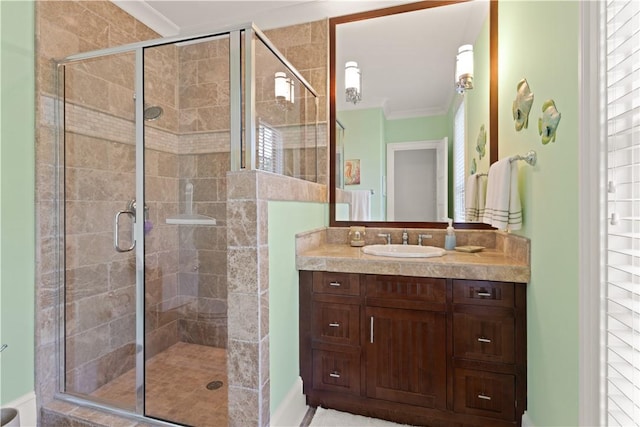 622 Beachview Dr, Saint Simons Island, GA 31522 - full bathroom with vanity, a shower stall, and crown molding