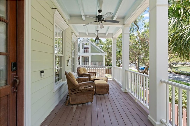 622 Beachview Dr, Saint Simons Island, GA 31522 - wooden porch with a ceiling fan