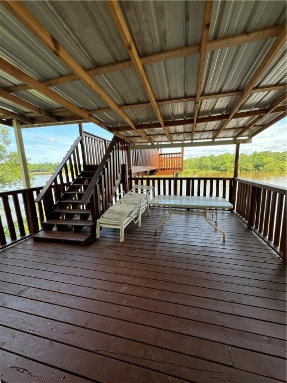 wooden terrace with a water view