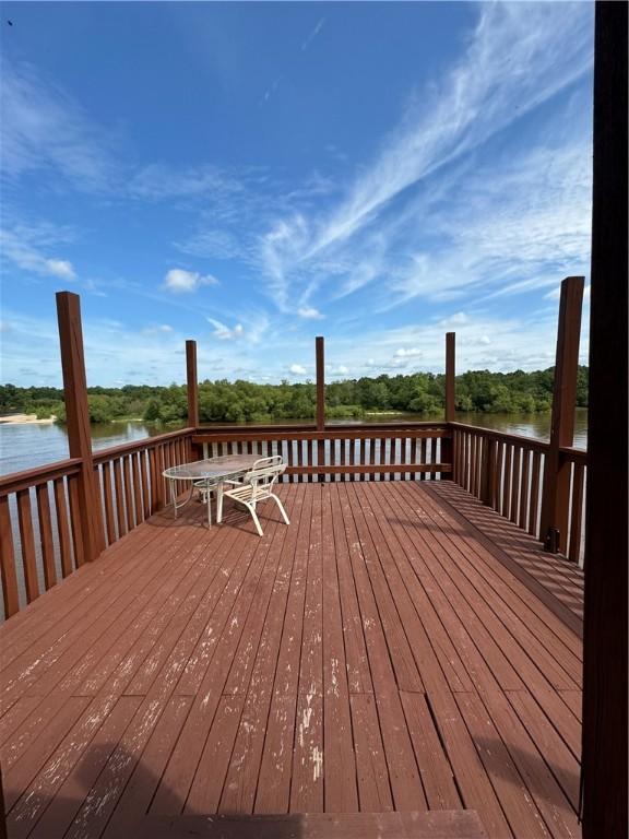 wooden deck with a water view