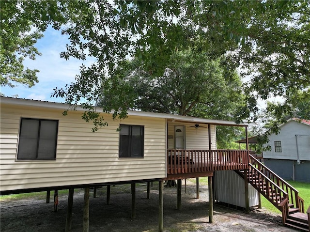 rear view of house with a wooden deck