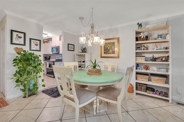 tiled dining space with ornamental molding and an inviting chandelier