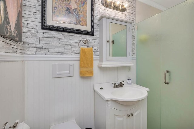 bathroom with vanity and wood walls