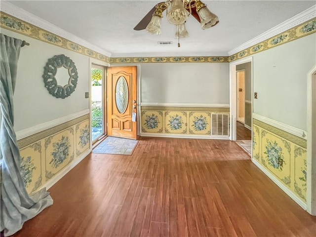 209 Lewis Dr, Rincon, GA 31326 - foyer with wood finished floors, a ceiling fan, wallpapered walls, ornamental molding, and a wainscoted wall