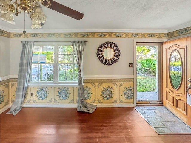 209 Lewis Dr, Rincon, GA 31326 - entrance foyer featuring wood finished floors, wallpapered walls, ornamental molding, a textured ceiling, and ceiling fan