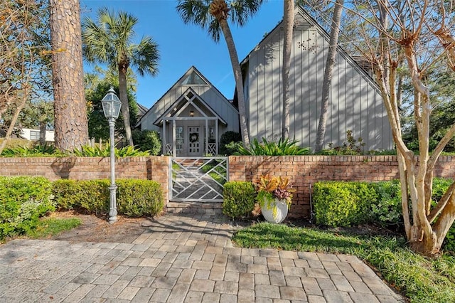 view of front of house featuring a gate and fence