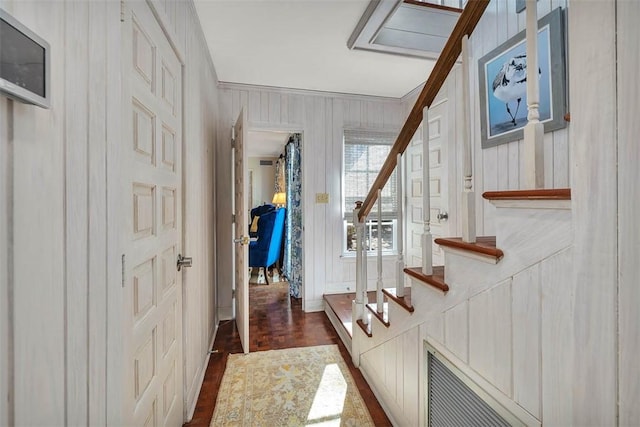 doorway to outside featuring dark wood-type flooring and stairs