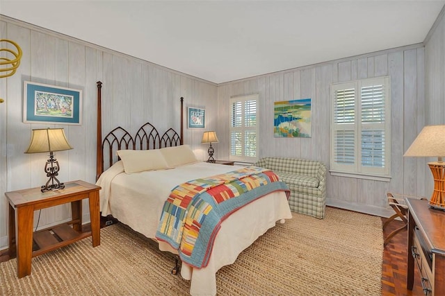 bedroom featuring multiple windows and baseboards