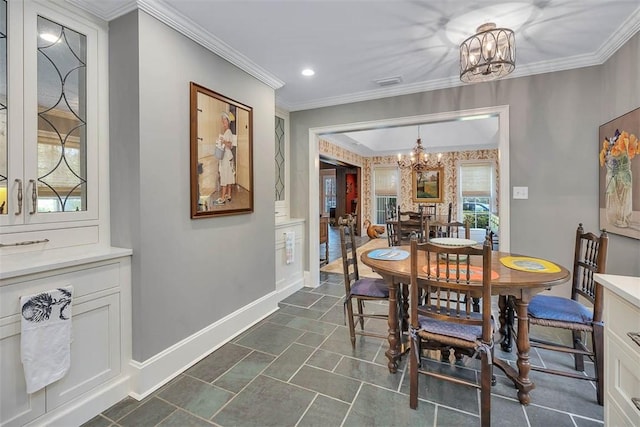 dining room with ornamental molding, recessed lighting, baseboards, and an inviting chandelier