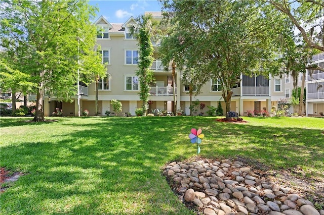 view of community with a yard